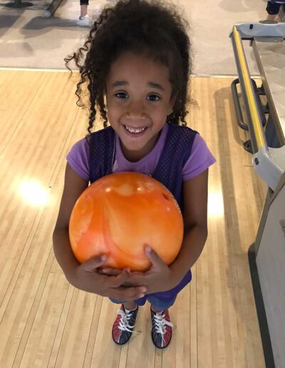 Girl holding a bowling ball