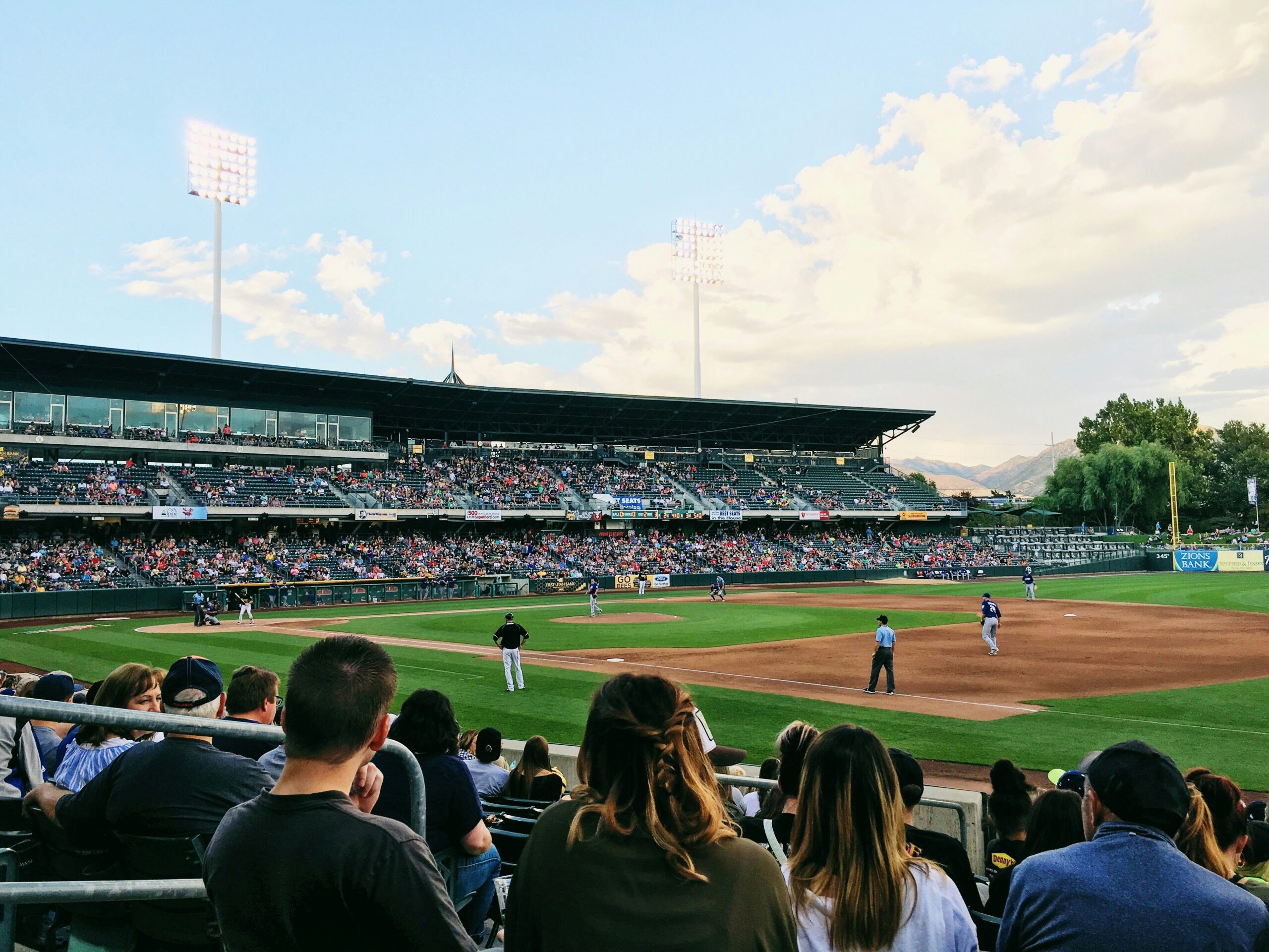 A picture of a baseball field for a major baseball team with people filling the stands.