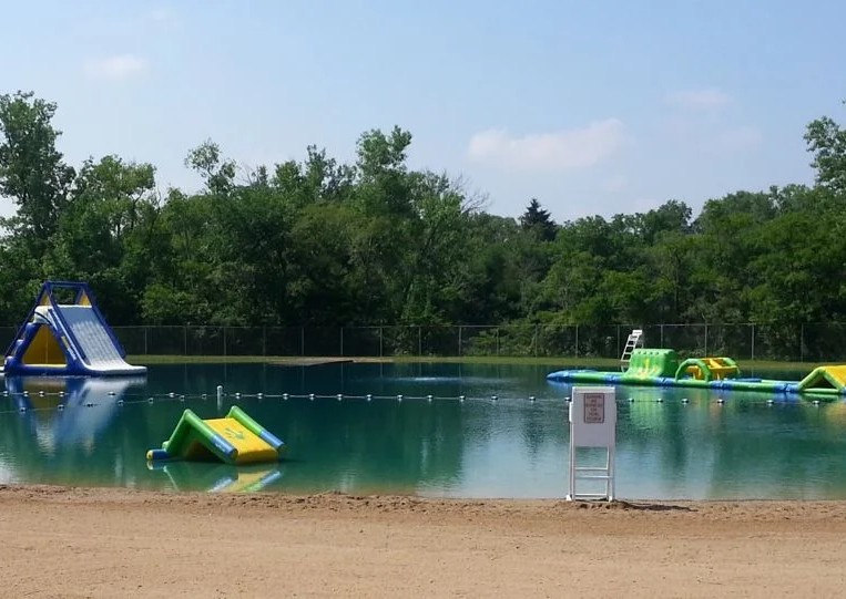 A picture of Troll Beach. It looks like a lake with play structures in it.